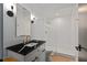 Modern bathroom with black countertop and white subway tile at 805 Peachtree Ne St # 504, Atlanta, GA 30308