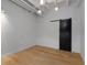 Bright bedroom with hardwood floors and barn door at 805 Peachtree Ne St # 504, Atlanta, GA 30308