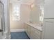 Bathroom with blue hexagonal floor tile and double vanity at 1059 Woodland Se Ave, Atlanta, GA 30316