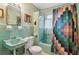 Retro bathroom with mint green fixtures and tiled walls at 3781 Narmore Ne Dr, Atlanta, GA 30319