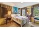 Bedroom with brass bed frame and colorful quilt at 3781 Narmore Ne Dr, Atlanta, GA 30319
