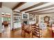 Living room with hardwood floors, exposed beams, and built-in shelves at 3781 Narmore Ne Dr, Atlanta, GA 30319
