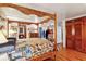Main bedroom with four-poster bed and hardwood floors, multiple views at 3781 Narmore Ne Dr, Atlanta, GA 30319