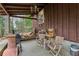 Covered patio with wood chairs and a grill at 3781 Narmore Ne Dr, Atlanta, GA 30319