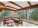 Sunroom with walls of windows, offering abundant natural light and wooded views at 3781 Narmore Ne Dr, Atlanta, GA 30319
