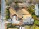 Aerial view of backyard featuring a patio area, stone fire pit, driveway, and well-manicured landscaping at 490 Rock Springs Ne Rd, Atlanta, GA 30324