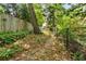 A picturesque backyard path is lined with greenery and mature trees, creating a serene outdoor setting at 490 Rock Springs Ne Rd, Atlanta, GA 30324
