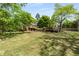 Lush green backyard featuring mature trees, offering shade and natural beauty at 490 Rock Springs Ne Rd, Atlanta, GA 30324