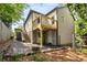 The backyard reveals an upper deck above a rock perimeter, with stairs to a gravel foundation at 490 Rock Springs Ne Rd, Atlanta, GA 30324