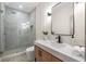Modern bathroom featuring a glass shower, sleek vanity, and elegant fixtures at 490 Rock Springs Ne Rd, Atlanta, GA 30324