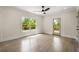 Sunlit bedroom with hardwood floors, large window, and deck access at 490 Rock Springs Ne Rd, Atlanta, GA 30324