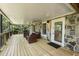 Inviting covered deck with stone accents and comfortable seating area to enjoy the outdoors at 490 Rock Springs Ne Rd, Atlanta, GA 30324