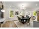 Bright dining room with hardwood floors and an open view into the adjacent living room at 490 Rock Springs Ne Rd, Atlanta, GA 30324