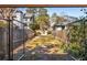 View from inside the gate shows the driveway leading to the property, with lush landscaping on either side at 490 Rock Springs Ne Rd, Atlanta, GA 30324