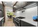 Modern kitchen with stainless steel appliances, quartz countertops, and sleek cabinetry at 490 Rock Springs Ne Rd, Atlanta, GA 30324