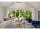 A bright living room with contemporary furniture, skylights and picture windows at 490 Rock Springs Ne Rd, Atlanta, GA 30324