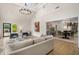 Bright living room featuring a modern chandelier, hardwood floors and sliding doors to the deck at 490 Rock Springs Ne Rd, Atlanta, GA 30324