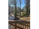 Spacious backyard featuring a storage shed and mature trees at 1876 Connally Dr, East Point, GA 30344