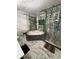 Relaxing bathroom featuring a garden tub, tiled walls, and decorative greenery at 1876 Connally Dr, East Point, GA 30344