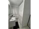 Bright bathroom with a modern vanity, toilet, and shower at 1876 Connally Dr, East Point, GA 30344
