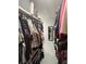 Walk-in closet with organized shelves and hanging racks for clothes and shoes at 1876 Connally Dr, East Point, GA 30344