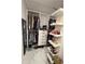 Organized walk-in closet with shelving, drawers, and ample hanging space at 1876 Connally Dr, East Point, GA 30344