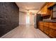 Open dining area with stone accent wall and wood flooring at 255 Rocky Ridge Dr, Douglasville, GA 30134