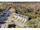 Aerial view of townhouses with wooded backdrop at 566 Maggie Ln, Jonesboro, GA 30238