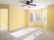 Bright bedroom with neutral walls, ceiling fan, and ample natural light at 566 Maggie Ln, Jonesboro, GA 30238