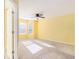 Bright bedroom with neutral walls, ceiling fan, and ample natural light at 566 Maggie Ln, Jonesboro, GA 30238