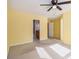 Bright bedroom with neutral walls, ceiling fan, and ample natural light at 566 Maggie Ln, Jonesboro, GA 30238