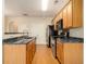 Stainless steel appliances and wood cabinets in kitchen at 566 Maggie Ln, Jonesboro, GA 30238