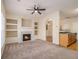 Living room with fireplace, built-ins, and carpet at 566 Maggie Ln, Jonesboro, GA 30238