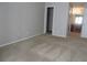 Spacious bedroom with neutral walls and carpet, featuring a large closet and access to a bathroom at 9400 Roberts Dr # 1C, Atlanta, GA 30350