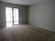 Bright bedroom with sliding glass doors leading to outdoor space and neutral carpeting at 9400 Roberts Dr # 1C, Atlanta, GA 30350