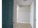 Front entry with coat closet and view to living room at 9400 Roberts Dr # 1C, Atlanta, GA 30350