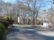 Exterior view of a condo community nestled in a wooded setting at 9400 Roberts Dr # 1C, Atlanta, GA 30350
