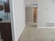 Hallway view into living room and kitchen at 9400 Roberts Dr # 1C, Atlanta, GA 30350
