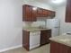 Updated kitchen featuring wood cabinets and granite countertops at 9400 Roberts Dr # 1C, Atlanta, GA 30350
