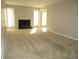 Bright and airy living room with neutral walls and carpet at 9400 Roberts Dr # 1C, Atlanta, GA 30350