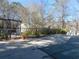 Community pool with safety cover and surrounding landscape, offering a relaxing outdoor space at 9400 Roberts Dr # 1C, Atlanta, GA 30350