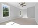 Bright bedroom featuring large windows and neutral carpet at 1168 Harmony Dr, Canton, GA 30115