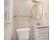 Updated bathroom with granite vanity and a large vanity mirror at 2224 Polar Rock Sw Ave, Atlanta, GA 30315