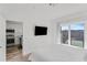Main bedroom with a king bed, and kitchen view at 525 Parkway Ne Dr # 404, Atlanta, GA 30354