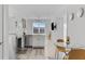Open concept dining area with glass table and modern chairs at 525 Parkway Ne Dr # 404, Atlanta, GA 30354