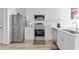 Modern kitchen with stainless steel appliances and granite countertops at 525 Parkway Ne Dr # 404, Atlanta, GA 30354