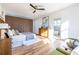 Bright bedroom with hardwood floors, large windows, and stylish mid-century modern furniture at 1063 Ormewood Ave, Atlanta, GA 30316