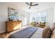 Spacious bedroom with hardwood floors, large windows and mid-century modern dresser at 1063 Ormewood Ave, Atlanta, GA 30316