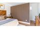 Modern bedroom with wood accent wall and stylish mid-century modern furniture at 1063 Ormewood Ave, Atlanta, GA 30316