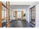 Bright entryway with dark gray slate tile flooring, white brick, and French doors at 1063 Ormewood Ave, Atlanta, GA 30316